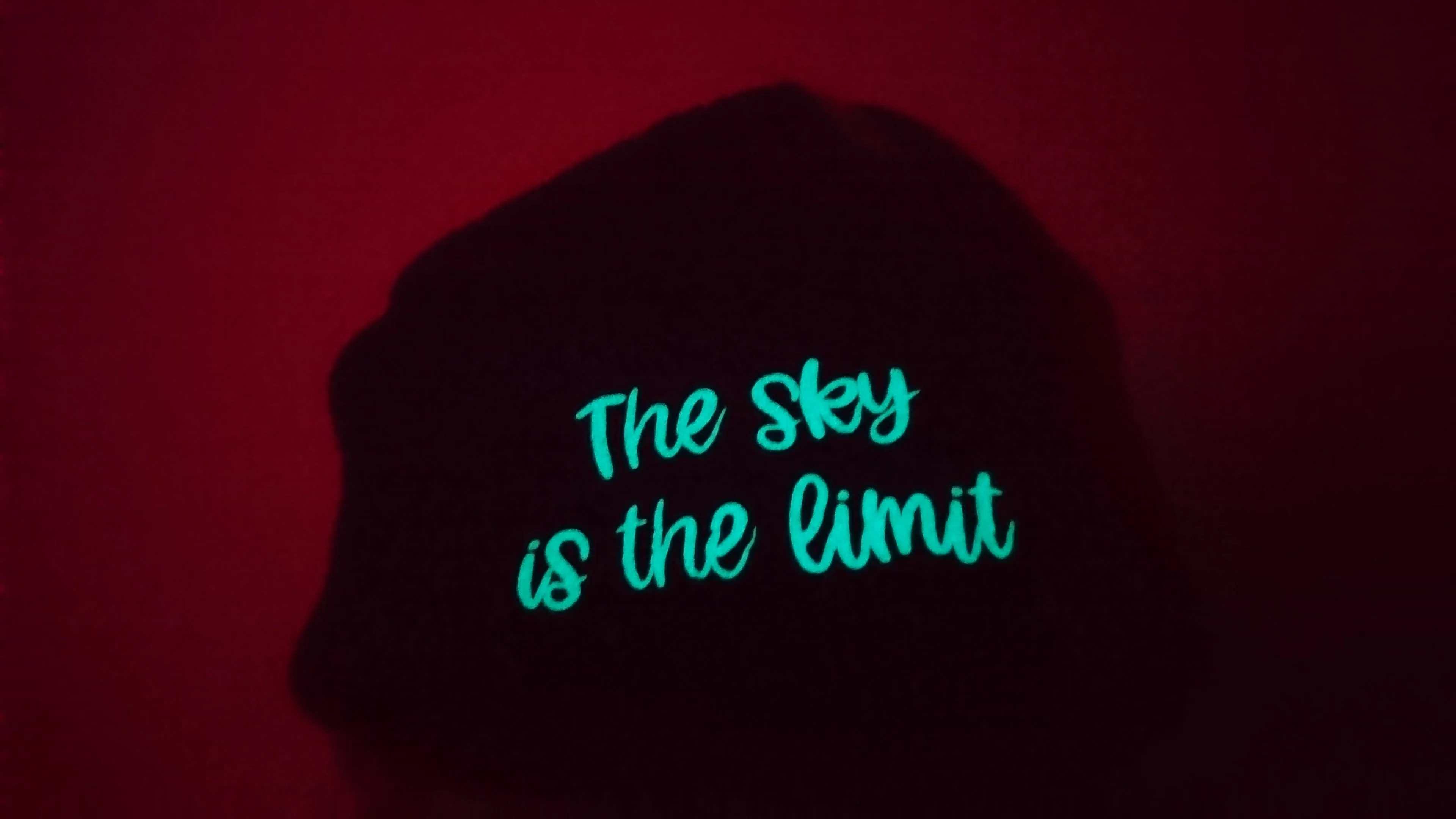 3D- Puff Glow in The Dark. Green Neon Vinyl on Black Supra Fleece Ski Hat with the quote "The Sky is the Limit". Comfy, Warm, Sport. One Size.